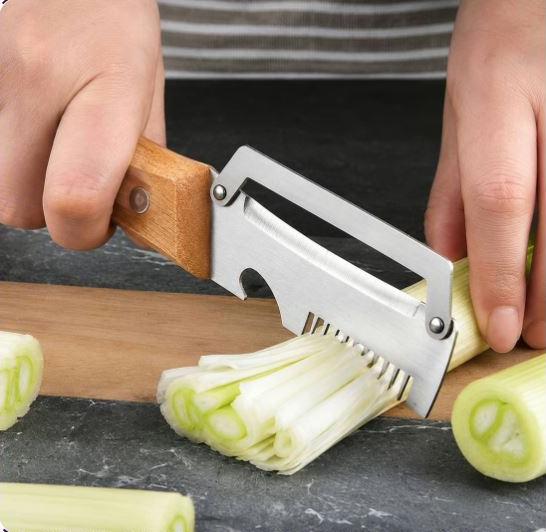 Close-up from the supplied PeelPro photograph showing julienne preparation on a cucumber